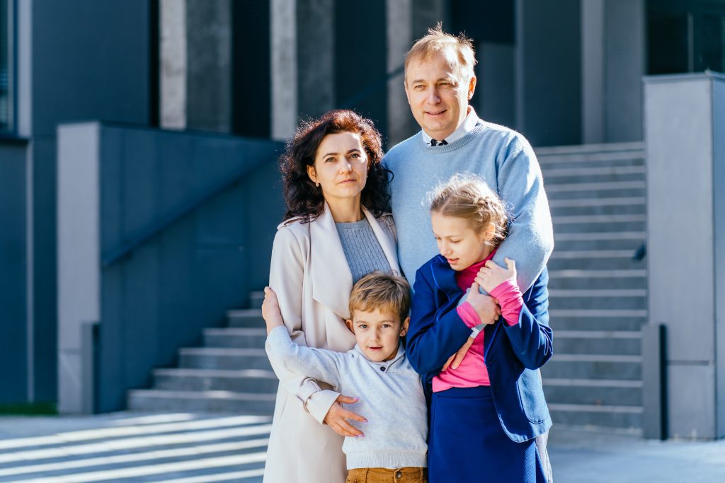 family outside court building representing family law and legal support